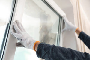 replacement window service technician installing